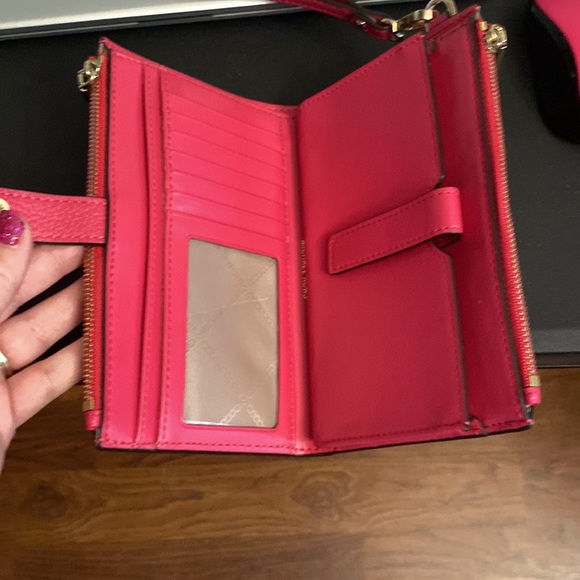 Michael kors wristlet.  Holds an I phone!